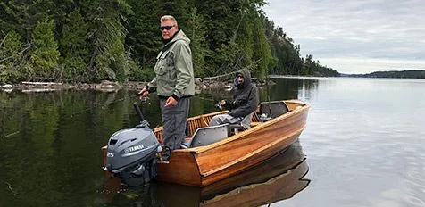 Couple Fishing In Boat On Clear Water Aspect Ratio 476 232