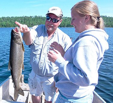 Father Daughter Fishing Caught A Lake Trout 1 Aspect Ratio 376 343