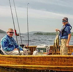 Guests With Stringer Of Fish Inside Boat Aspect Ratio 235 232