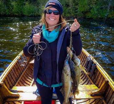 Woman Holding A Stringer Full Of Walleye Catches Aspect Ratio 376 343